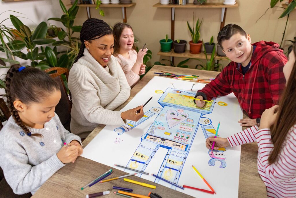 Children and teacher drawing a colorful robot.