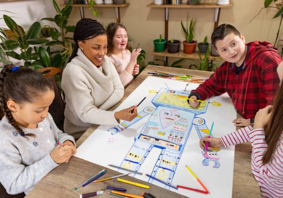 Children and teacher drawing a colorful robot.